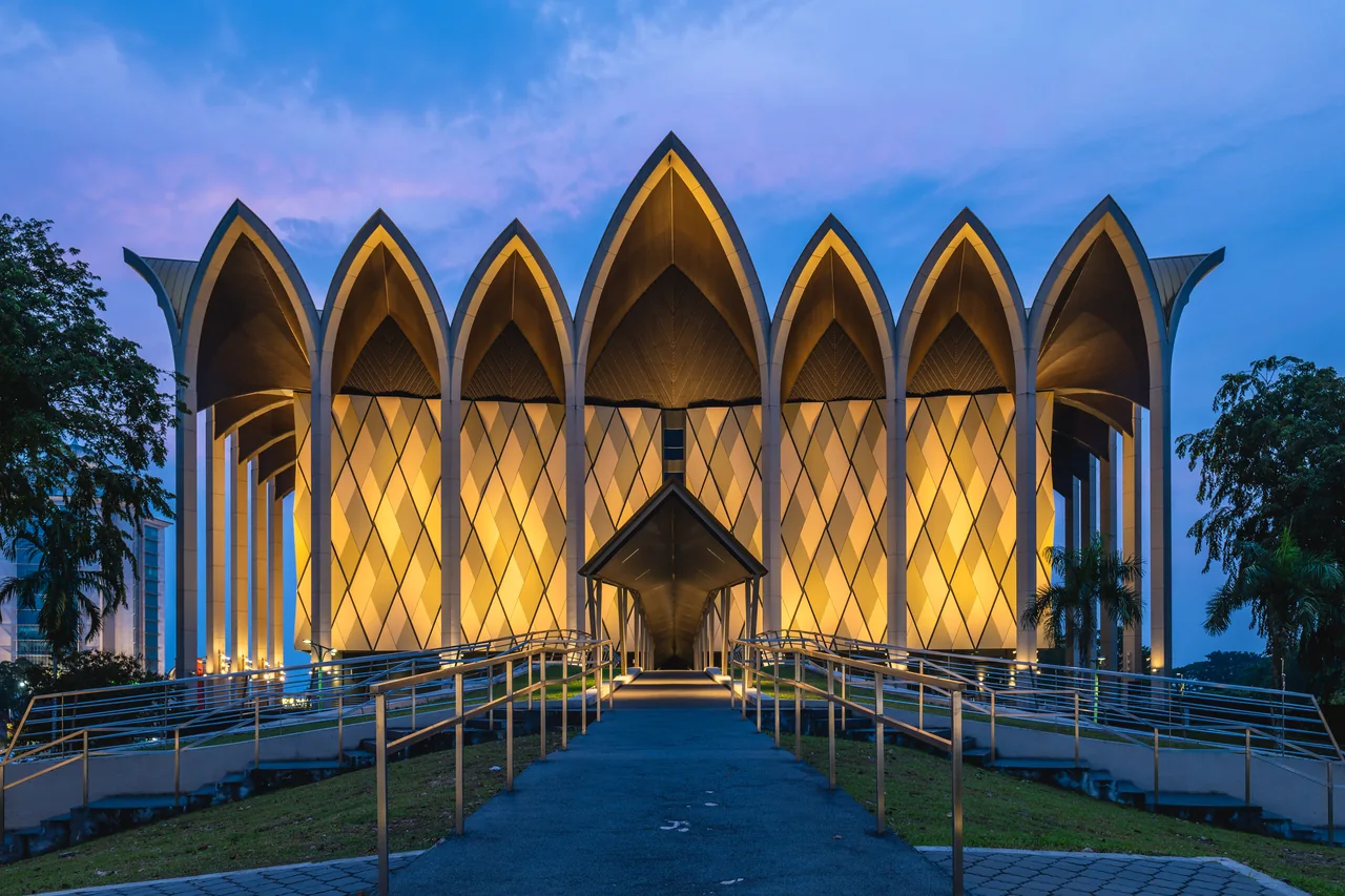 The illuminated Borneo Cultures Museum at dusk